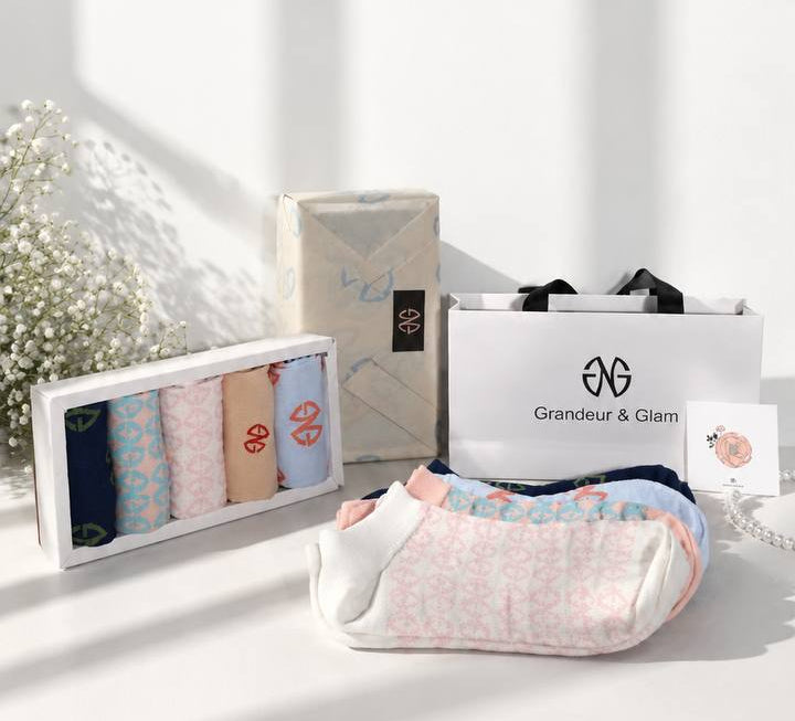 GAILESH gift set with five fashion socks in a presentation box, wrapped gift box, gift bag, and a single sock displayed on a white surface.