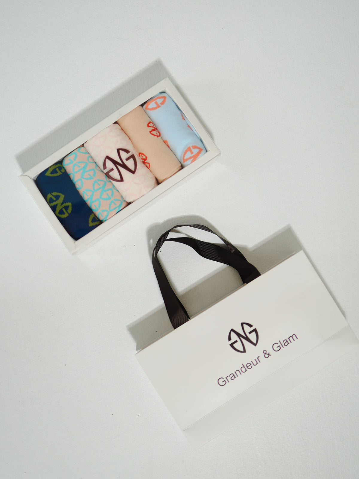 GAILESH gift set with five fashion socks in a presentation box and structured Grandeur & Glam gift bag.